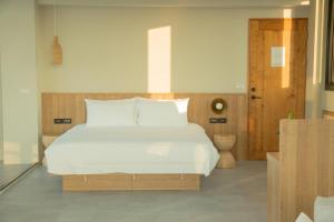 Postel nebo postele na pokoji v ubytování Golden Harvest Homestay