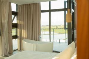Postel nebo postele na pokoji v ubytování Golden Harvest Homestay