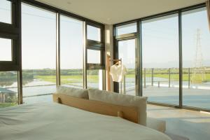 Postel nebo postele na pokoji v ubytování Golden Harvest Homestay