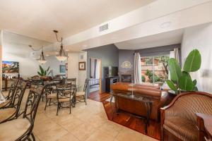 a living room and dining room with a couch and a table at Uptown Sedona Gem: 3-Bed Townhome with Majestic Views and Central Location in Sedona