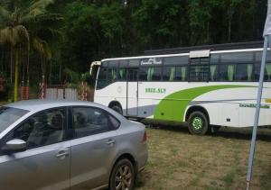 a car parked in front of a bus at coorg camping tent stay in Suntikoppa