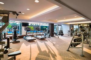 a gym with cardio equipment in a hotel room at Le Meridien Nagpur in Nagpur