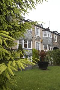 a building with a plant in front of it at The Studley Hotel in Harrogate