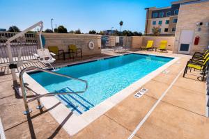a swimming pool with a camera on top of a building at SpringHill Suites by Marriott Newark Fremont in Newark