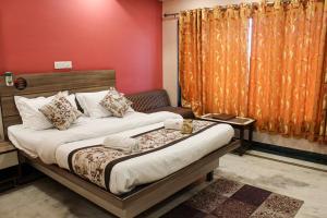 Katil atau katil-katil dalam bilik di Hotel Gujrat