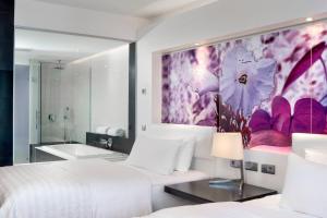 Postelja oz. postelje v sobi nastanitve Le Méridien Nouméa Resort & Spa