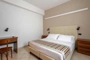 Postel nebo postele na pokoji v ubytování A Casa Dei Gonzaga