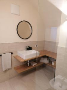 a bathroom with a sink and a mirror at Fruemess - Historic Refugium in Parcines +14 photos