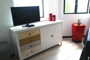 TV a/nebo společenská místnost v ubytování Apartamento Quinta Nova