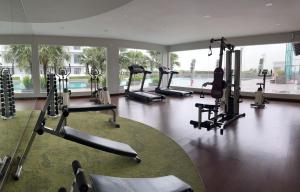 a gym with several tread machines in a room at RNR Homestay in Johor Bahru