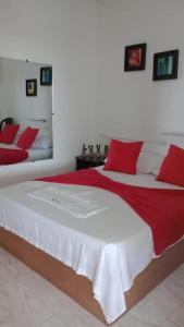 Postel nebo postele na pokoji v ubytování Hostal Kumbaya