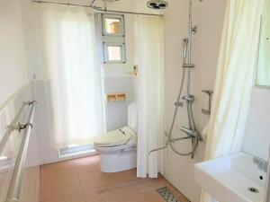 a white bathroom with a toilet and a shower at Blue cave Blue in Green - Vacation STAY 31651v in Fukai