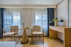Posezení v ubytování Yiwu Baide Theme Hotel