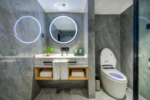 Koupelna v ubytování Yiwu Baide Theme Hotel