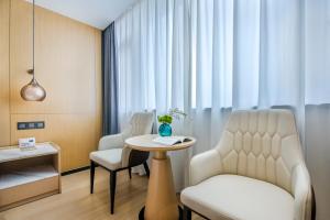 Posezení v ubytování Yiwu Baide Theme Hotel