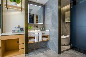 Koupelna v ubytování Yiwu Baide Theme Hotel