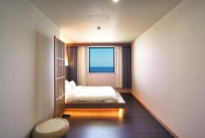 Gyeongju Denbasta Ryokan客房内的一张或多张床位