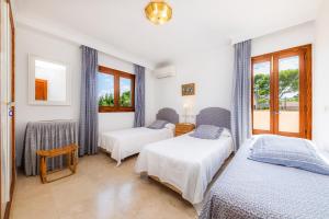 Postel nebo postele na pokoji v ubytování Villa Tita