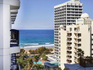 a view of the ocean from the balcony of a hotel at Stay in the heart of Surfers in Gold Coast