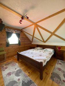 a bedroom with a bed in a room at Eco Village Highlander in Žabljak