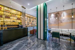 Lounge nebo bar v ubytování Yiwu Baide Theme Hotel