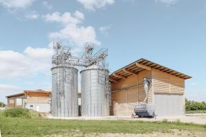 a building with two silos in front of it at Ferienwohnung Lehner in Wetzleinsdorf
