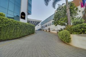 a cobblestone street in front of a building at Palette - Hotel chennai le palace in Chennai