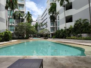 an empty swimming pool in an apartment building at 2 Floor - The Base Downtown Condominium next to Central Shopping Mall in Phuket
