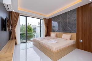 Postel nebo postele na pokoji v ubytování S2 Aria Resort + 21 fotografií