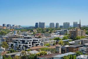 an aerial view of a city with tall buildings at South Yarra 1Br Apartment in Melbourne