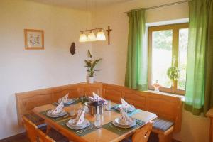 a dining room table with dishes on top of it at Ferienhaus Masser in Mainsdorf