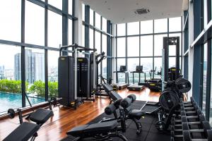 a gym with treadmills and exercise equipment in a building at Stay @ NOVO Ampang in Kuala Lumpur