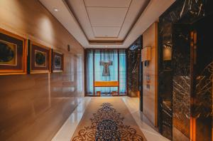 a hallway with a large window and a rug at Hilton Xi'an in Xi'an