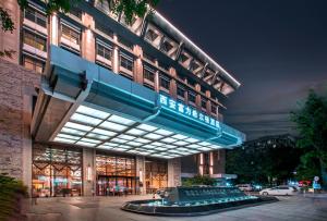 a building with a sign on the side of it at Hilton Xi'an in Xi'an