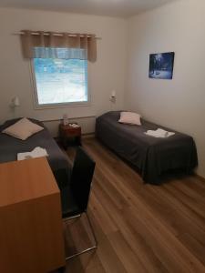 Postel nebo postele na pokoji v ubytování Hostel Tikka