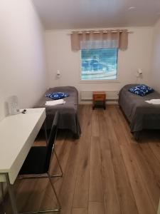 Postel nebo postele na pokoji v ubytování Hostel Tikka