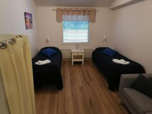 Postel nebo postele na pokoji v ubytování Hostel Tikka