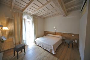 Posteľ alebo postele v izbe v ubytovaní 32 BnB Camerecaffè