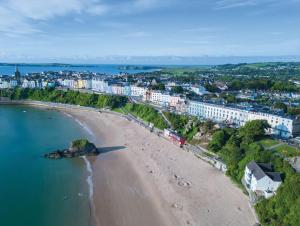 an aerial view of a beach and buildings at No 4 Croft House - Luxury 2 Bed Apartment - Tenby in Tenby