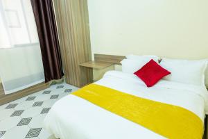Cama o camas de una habitación en Mang City Hotel