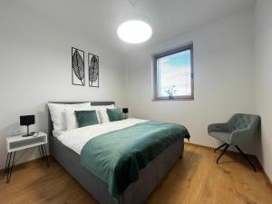 Postel nebo postele na pokoji v ubytování Apartmány Kamenec