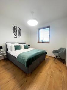 Postel nebo postele na pokoji v ubytování Apartmány Kamenec