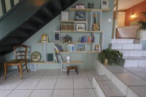 a room with a staircase with a desk and a chair at Les Eaux Vives in Sévrier