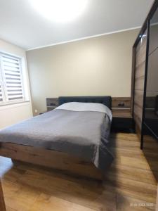 Кровать или кровати в номере Darłówko Apartament Morski XIII