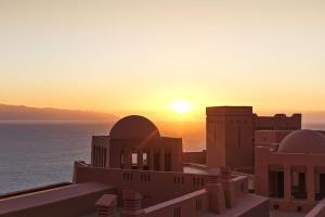 a view of the sun setting over the ocean at The Ritz-Carlton Tenerife, Abama in Guía de Isora