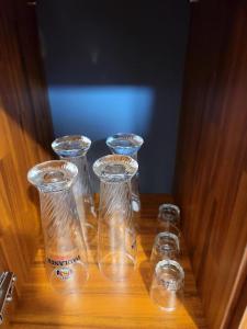 a group of empty glass bottles sitting on a table at Zibro in Gunsan