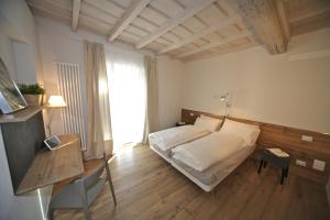 Posteľ alebo postele v izbe v ubytovaní 32 BnB Camerecaffè