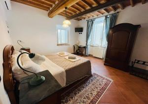 Postel nebo postele na pokoji v ubytování B&B Giardino delle Camelie