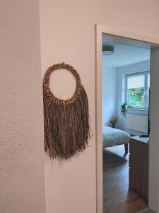 a wreath hanging on a wall next to a mirror at Bergoase Relax&Spa in Unteropfingen