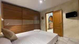 Łóżko lub łóżka w pokoju w obiekcie Apartamento Golf Beach